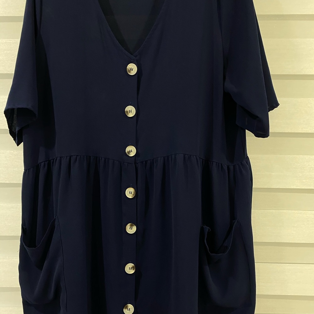 V-neck dress with buttons.